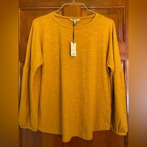 Juicy Couture yellow gold long sleeve top.